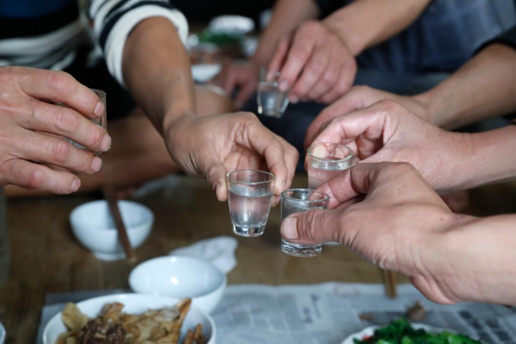 Vietnamese,Food,In,House.,Vietnamese,Party.,Close-up,Of,Hands,Toasting - - Fareast247